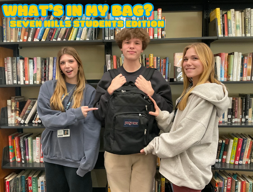 Hazel Doepke, Aj Lee, and Hattie Culpepper showcase one of the many backpacks being unpacked!